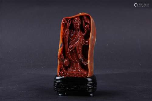 A CHINESE SOAPSTONE FIGURE OF AVALOKITESHVARA (â€˜GUAN