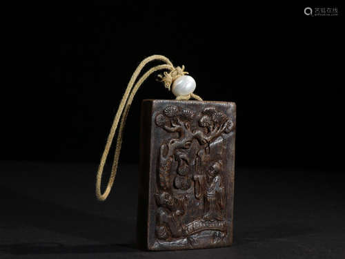 A CHENXIANG WOOD PENDANT WITH PINE TREE CARVING