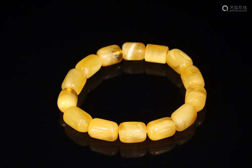 AN AMBER BRACELET WITH BRIGHT YELLOW COLOR