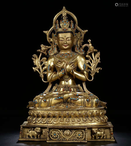 A GILT BRONZE CASTED GEM DECORATED BUDDHA