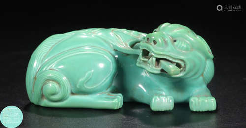 A GREEN GLAZE LION SHAPED PENDANT