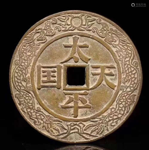 A BRONZE CASTED CIRCLE COIN