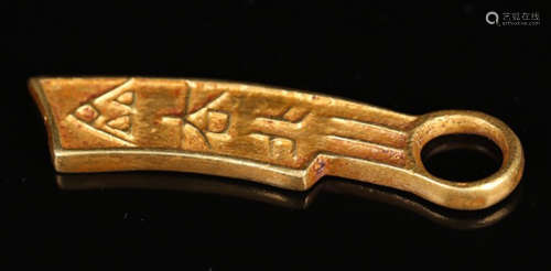 A GOLD KNIFE SHAPED COIN