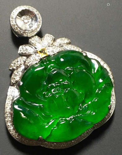 A GREEN JADEITE CARVED PEONY PENDANT, TYPE A