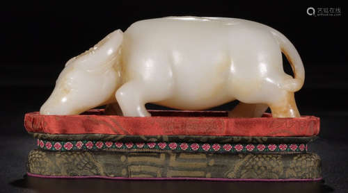 A HETIAN JADE CARVED COW SHAPED PENDANT