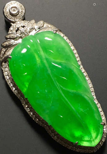 A GREEN JADEITE CARVED LEAF PENDANT, TYPE A