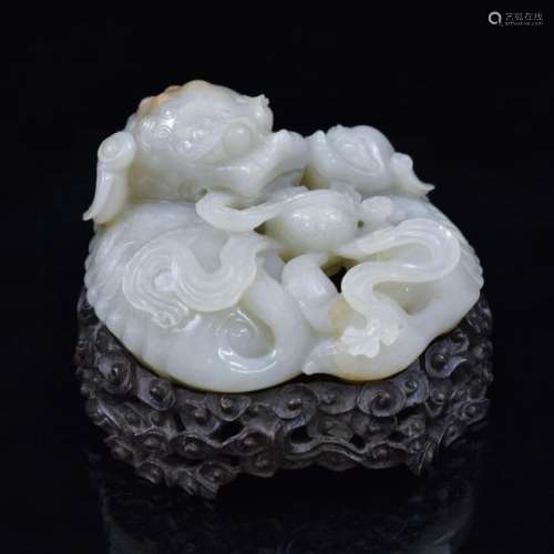 CARVED WHITE JADE OF THREE FOO-DOGS ON STAND