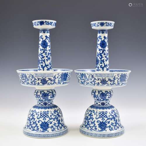 PAIR QIANLONG BLUE & WHITE WRAPPED FLORAL CANDLE STANDS