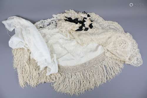 A Cream Silk Shawl: the shawl together with a Victorian Lace Collar, bib collar and a lace bonnet