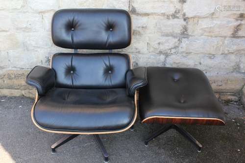 An Eames-style Recliner Chair and Ottoman: rosewood and black leather, chair approx 85 x 62 x 87 cms