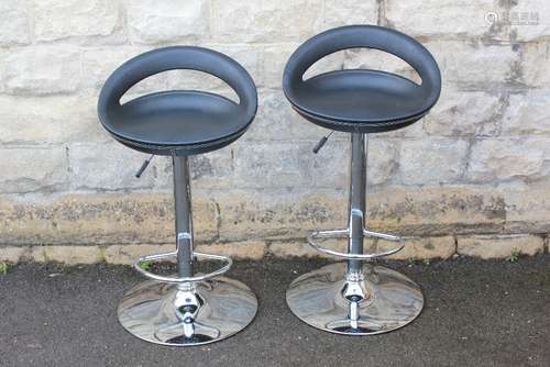 A Pair of Contemporary Chrome and Black Leather Bar Stools