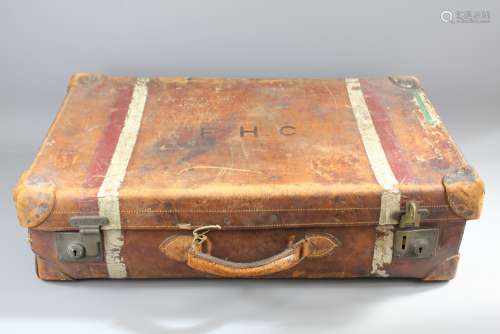 A Large Vintage Leather Suitcase: The suitcase bearing the initials EHC - belonging to Emmeline Hannah Cadbury, made by Greaves, New Street, Birmingham, approx 77 x 20 x 45 cms