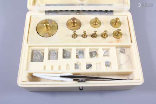A Set of Baird and Tatlock Chemist Weights, contained in an ivory bakelite box