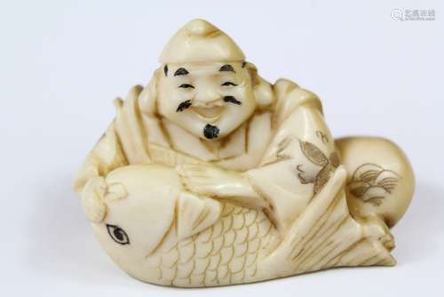 A 19th Century Carved Netsuke, 'Carp and Fisherman', approx 4 cms l, with character marks to base