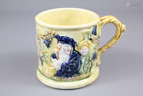 An Early 20th Century Yellow/Green Glazed 'Surprise' Mug