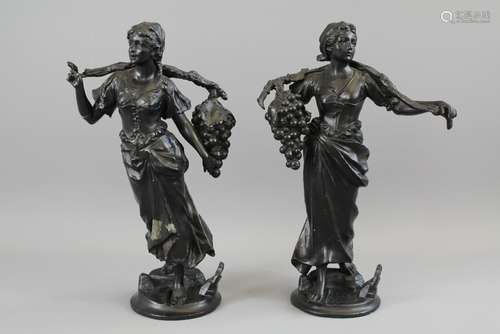 Two Black Composite Figures depicting The Grape Pickers, approx 36 cms h