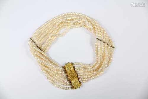 An Antique Continental Nine-Strand Fresh Water Pearl Choker, with floral gilt-metal clasp, approx 33 cms l x 4 w cms