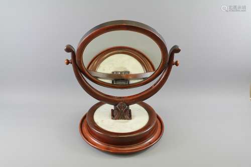 An Edwardian Circular Mahogany Vanity Mirror