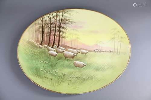 An Oval Staffordshire Charger, painted with a pastoral scene, signed J