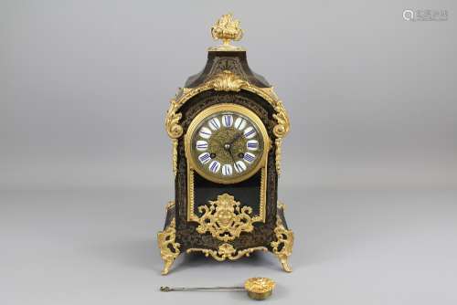 A 19th Century French Ebony and Ormolu Mantel Clock