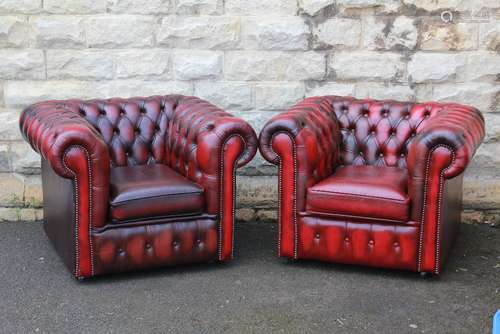 A Pair of Claret Leather Button Back Club Chairs in the Chesterfield style