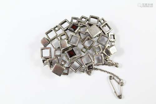 A Silver and Garnet Modernist Brooch, set with two square-cut garnets, approx 50 x 35 mm, mm L