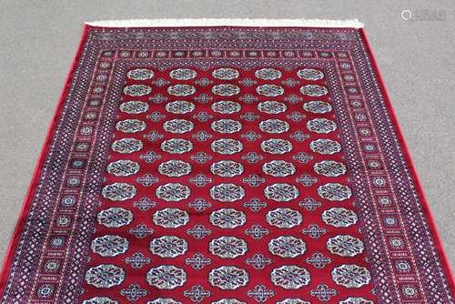 A Red Ground Bokhara Carpet