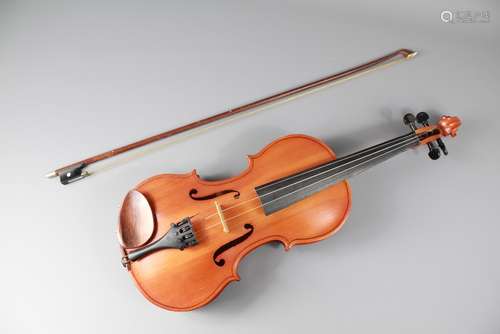 An Eastern European 3/4 Violin and Bow, nr 2254, bears labels to the interior, no case, possibly Hungarian