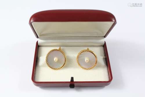 A Pair of 21ct Gold, Pearl and Mother-of-Pearl Cuff Links: the circular gents cuff links in fitted 