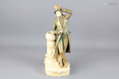 A Continental Ceramic Figurine of an 18th Century Style Man: the man leaning on a jardiniere with a walking stick in his right hand