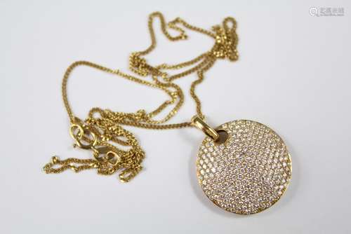 An 18ct Yellow Gold Pave Set Diamond Disc Pendant