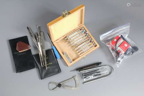 Jeweler's Accessories: This lot includes eight loupe, micrometer, Shindler scale, diamond weight calculator, diamond weight gauge, a boxed set of jewellery screw drivers, three stone pincers, small quantity of screw backs