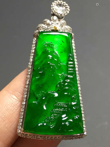 AN ICY ZHENGYANG GREEN JADEITE PENDANT