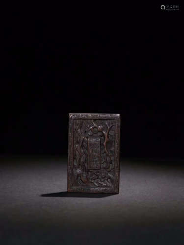 A CHENXIANG WOOD TABLET WITH FLORAL CARVING