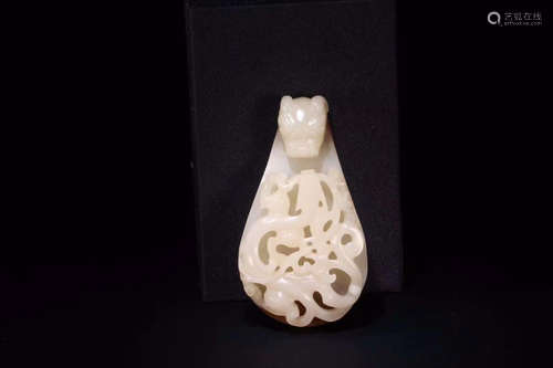 A HETIAN JADE PENDANT WITH STORY CARVING