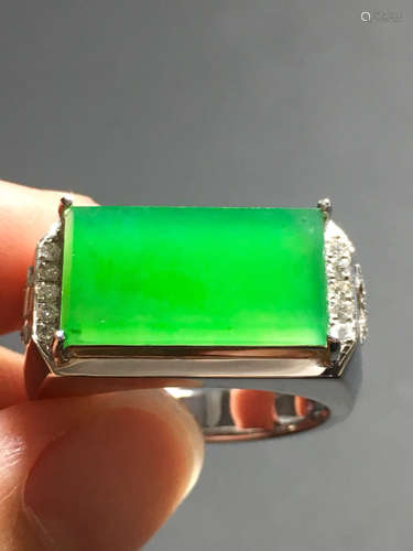 AN ICY ZHENGYANG GREEN JADEIET RING IN SADDLE CARVED