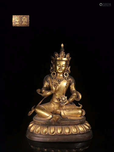 A GILT BRONZE GUANYIN SHAPED ORNAMENT