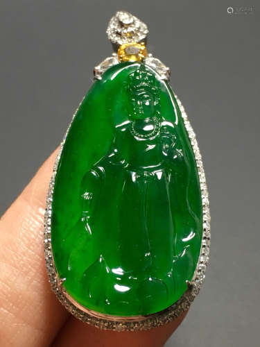 AN ICY GREEN JADEIET GUANYIN PENDANT