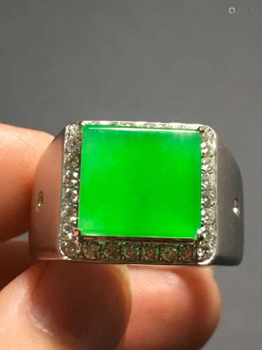 AN ICY ZHENGYANG GREEN JADEIET RING IN SADDLE CARVED