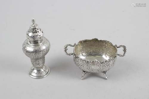 A German pepper pot of inverted pear shape with pierced cover,