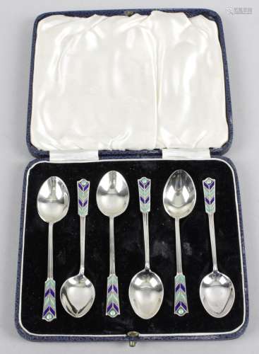 A mid-twentieth century cased set of six silver and enamel teaspoons,