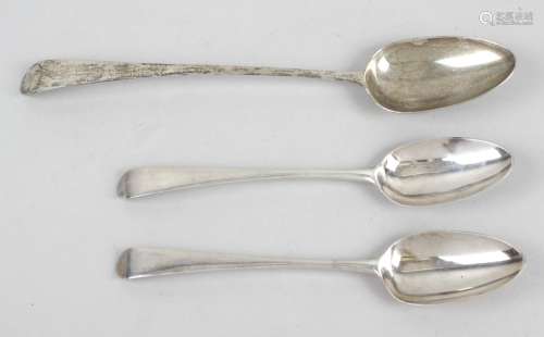 A George III silver basting spoon and a pair of slightly later table spoons,