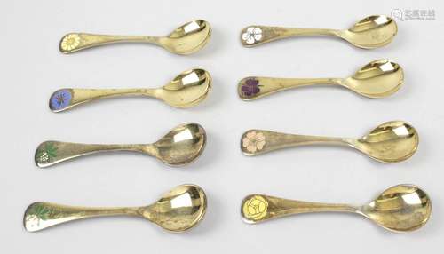 A selection of eight Georg Jensen silver-gilt year spoons,