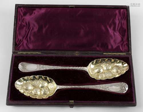 A cased pair of George II silver 'berry' spoons,