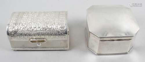 A Middle-Eastern box modelled as a casket with foliate and scroll embossed hinged cover,