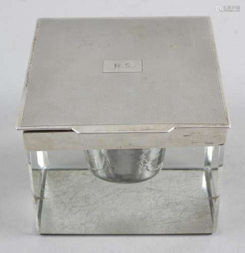 A 1930's large glass desk inkwell of plain square form,