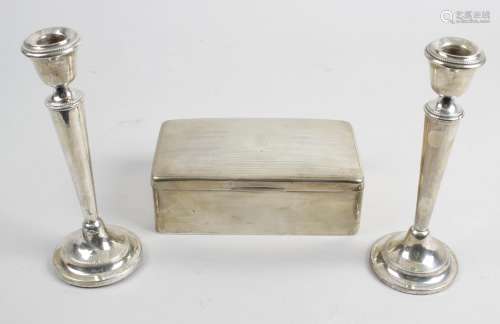 A pair of 1920's silver mounted candlesticks,