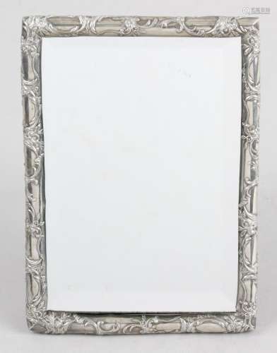 A German silver mounted mirror of small rectangular form,