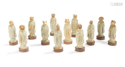 Ensemble de douze statuettes en céramique et émail…