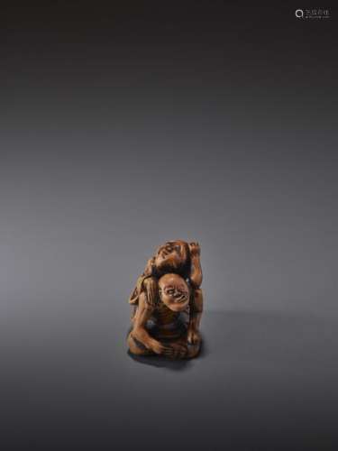 A WOOD NETSUKE OF A BLIND MASSEUR WITH CLIENT BY B…